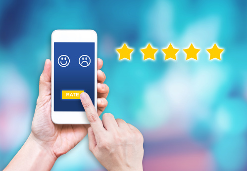 hand click rating on mobile to give satisfaction of service online.customer review experience of service