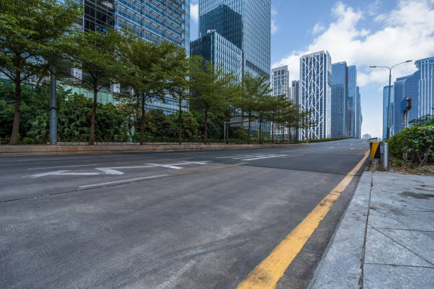 istock empty asphalt road with city skyline background in china 1187936348