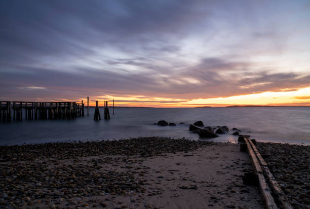 istock Purple sunset at the beach 1187948264