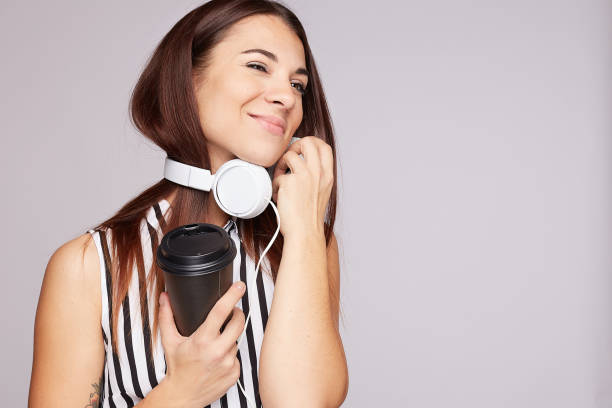 istock Beautiful woman models over grey wall with copy space for your advertisement or promotion. 1187950006