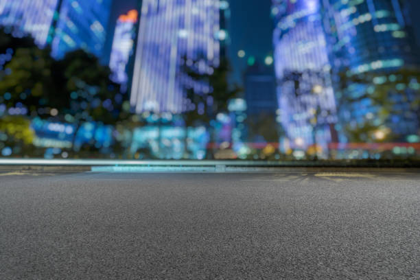 istock empty urban road with modern building at night 1187957304
