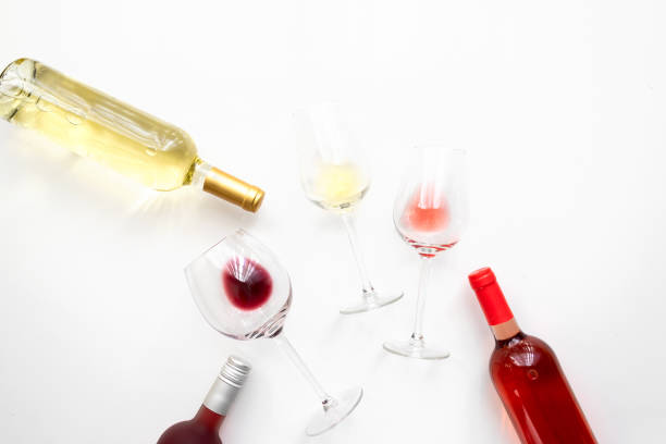 istock Different wines  bottles red, white, rose on white concrete background. Abstract wine degustation concept. Copy space 1187962466