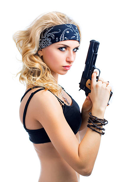 young sexy girl with gun stock photo