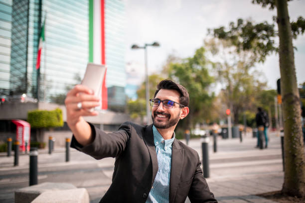 istock Young businessman taking a selfie 1187964428