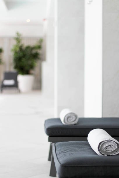 istock Chairs with towels next to the pool 1187969163