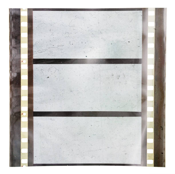 istock real scan of original 70mm film material or strip on white background with empty frames or cells and foil effect 1187974166