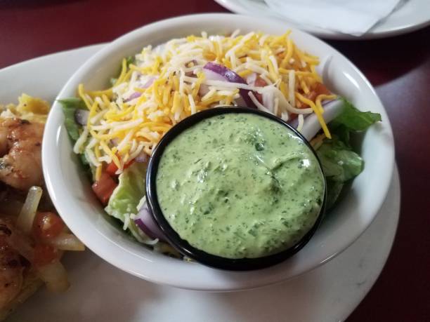 istock salad with lettuce and cheese and green sauce 1187974205