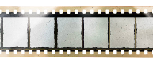 long 35mm film or movie strip with empty frames or cells on white background, just blend in your photos to make them look vintage long 35mm film strip isolated 35mm movie camera stock pictures, royalty-free photos & images