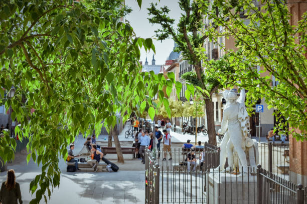 Numerous young people and tourists meet frequently in the historic Plaza del Dos de Mayo. This urban square is the neuralgic centre of the Malasaña area. stock photo