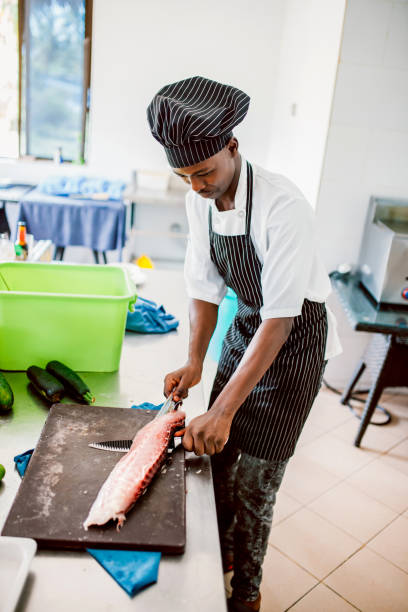 istock Chef preparing fish or seafood meal 1187976439