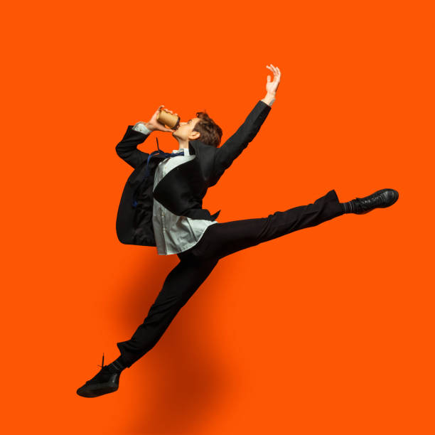 istock Man in casual office style clothes jumping isolated on studio background 1187976776