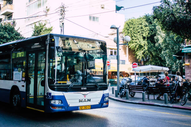 Tel Aviv Israel November 14, 2019 View of traditional Israeli public city bus rolling in the streets of Tel Aviv in in the afternoon