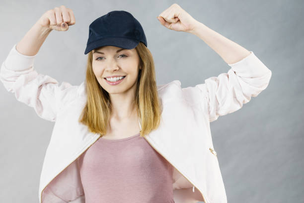 istock Young woman showing her arm muscles 1187980565