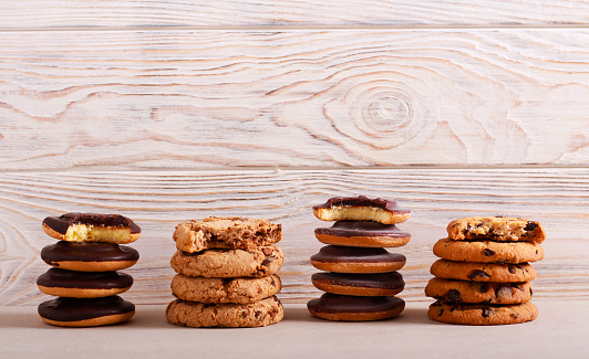 Selection of girl scout cookies over white wooden background