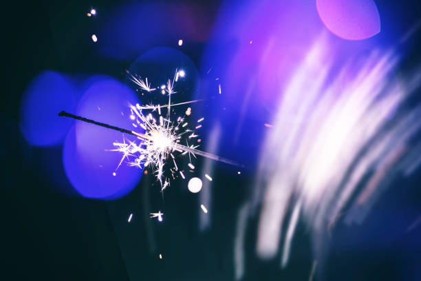 istock christmas sparkler glowing in the dark 1187982348