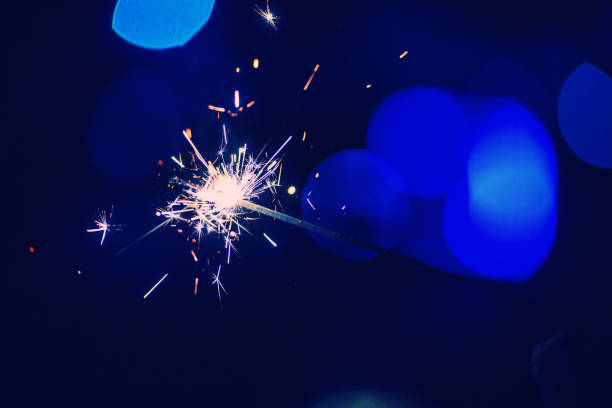 istock christmas sparkler glowing in the dark 1187982376