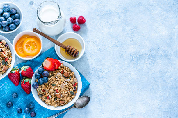 istock Healthy eating: granola bowl with fruits for breakfast. Top view with copy space 1187982564