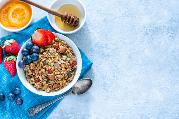 istock Healthy eating: granola bowl with fruits for breakfast. Top view with copy space 1187985272