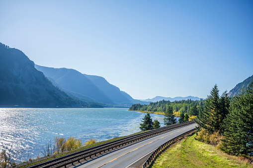 istock Railway track and vehicles road along the Columbia River in Columbia Gorge 1187986361