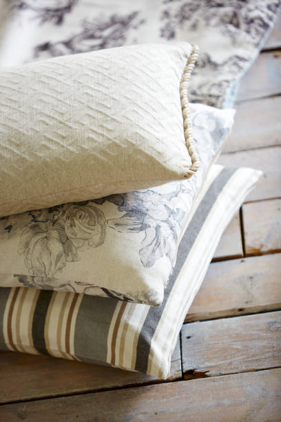istock Pillows on hardwood floor 1187989218