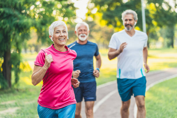 istock Senior athletes jogging in the park 1187990614