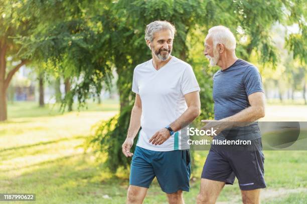 Senior Friends Jogging Stock Photo - Download Image Now - Walking, Men, Senior Adult