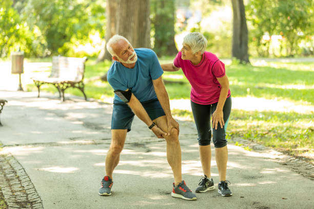 istock Senior Man has a Knee Injury in Public Park 1187990907