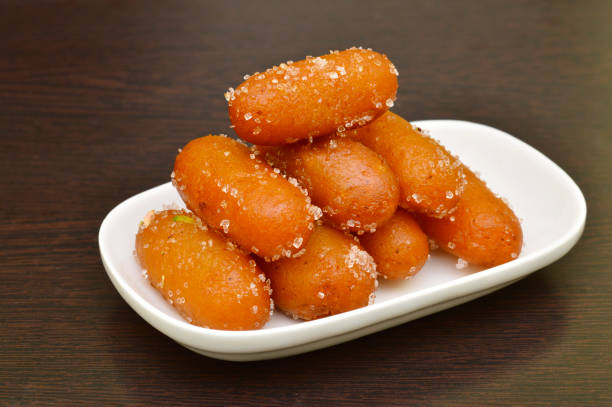 istock Gulab Jamun, an Indian desert with sugar on it in a white plate 1187991966