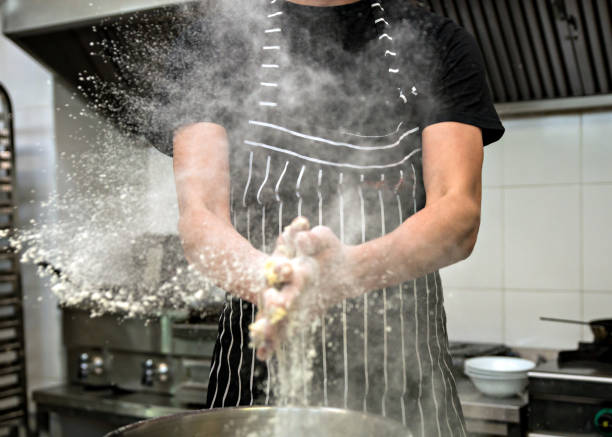 istock Clap hands of baker with flour in kitchen 1187992003