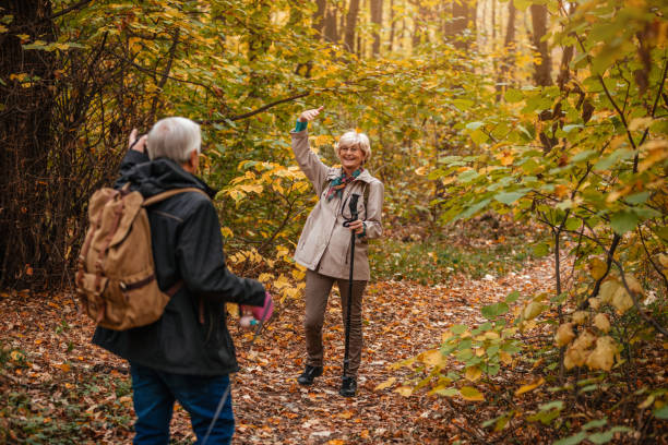 istock Senior Couple Hiking With Their Dog 1187993492