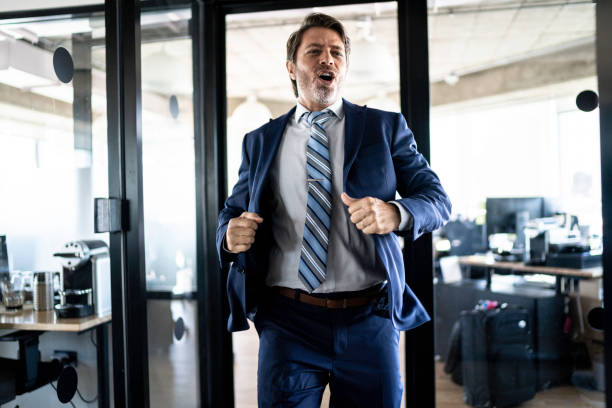 istock Businessman celebrating in the office 1187993810