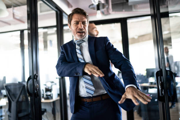 Coworkers walking and dancing around the office