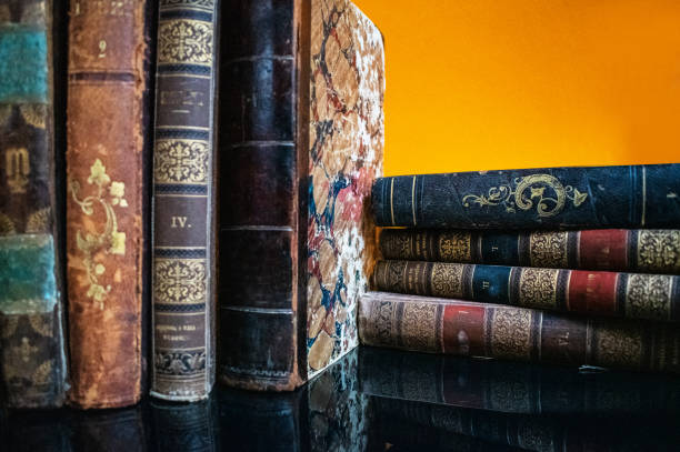 istock Old book in a yellow bacraund 1187994826