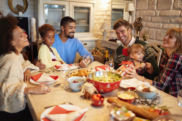 istock multi ethnic friends have fun at a family Christmas dinner 1187995739