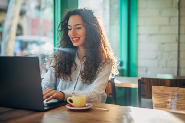 istock Young lady man using laptop in cafe 1187995777