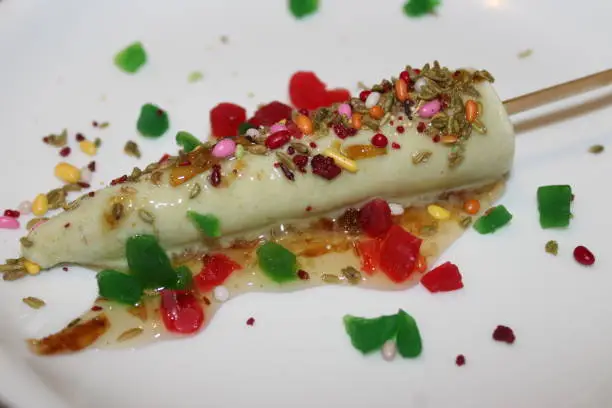Close up of Kulfi with colorful topping