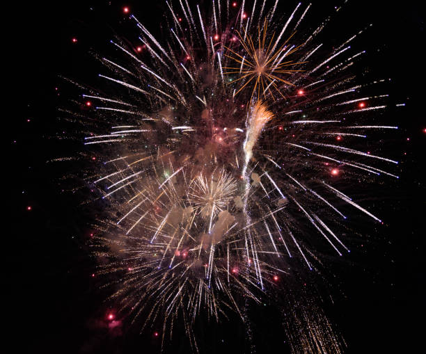 istock Colorful explosion of fireworks on the black background 1187998285