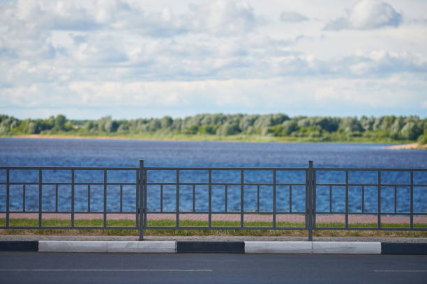 Fencing on the river embankment. Iron railing to protect and support people on walk.