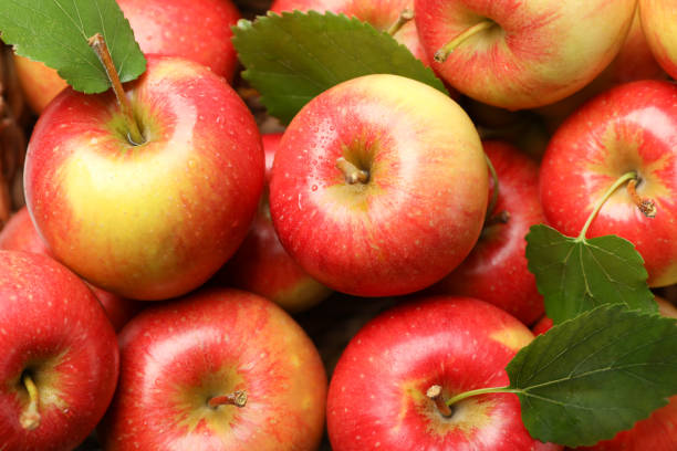 istock Sweet red apples on whole background, close up 1187998829