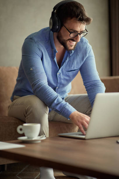 istock people working at home- Smiling business man uses a laptop 1187999550