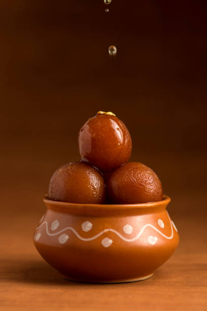 Gulab Jamun in clay pot. Indian Dessert or Sweet Dish stock photo