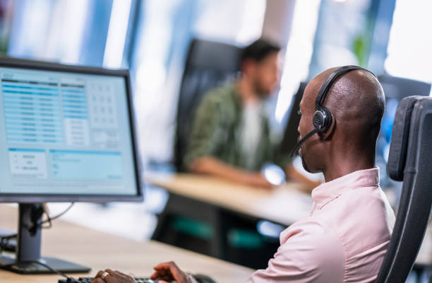 istock African-American Man Talking To A Customer Over A Headset 1188002059