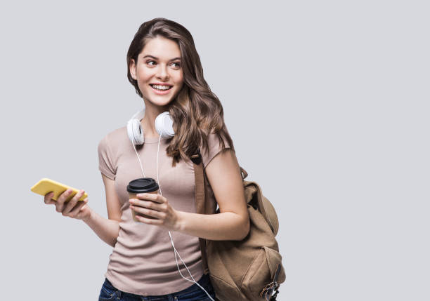istock Happy smiling student girl using smart phone 1188002895