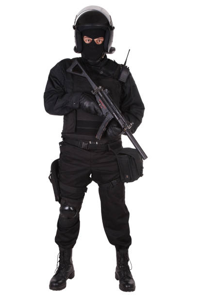istock police special forces officer with submachine gun in black uniform 1188004934