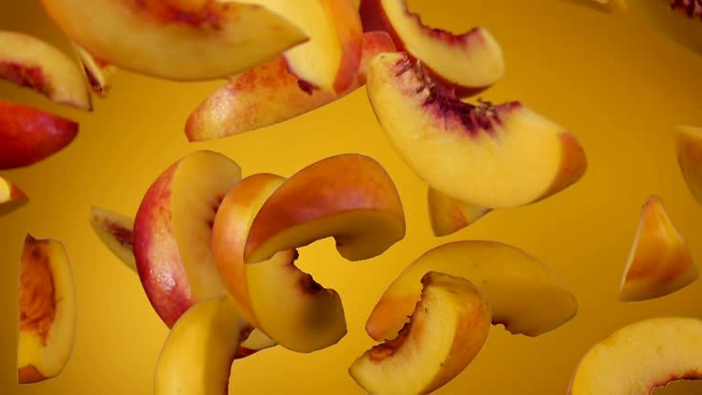 Peach slices bounce on a yellow background