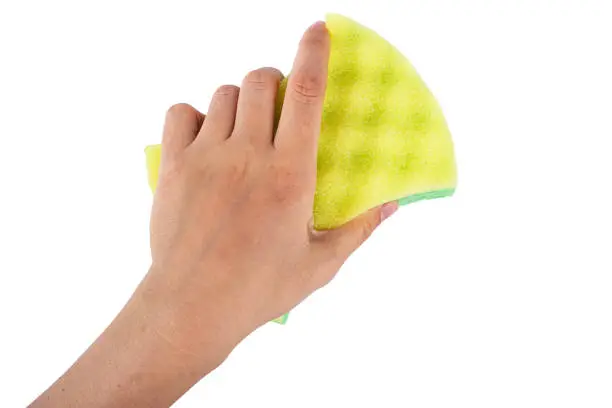 Photo of female hand with a washcloth. isolated on a white background.