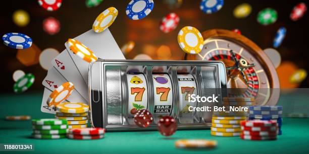 Online Casino Smartphone Or Mobile Phone Slot Machine Dice Cards And Roulette On A Green Table In Casino 3d Stock Photo - Download Image Now