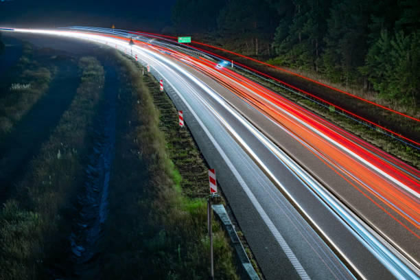 istock lights of cars with night 1188015473