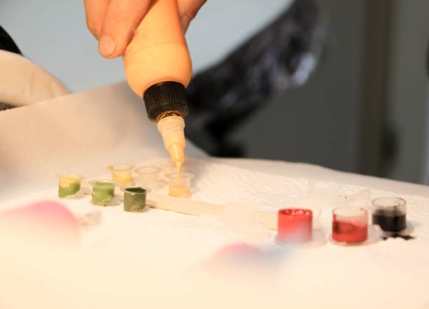 istock Professional tattoo artist doing tattoo in studio 1188016512