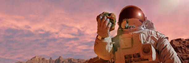 istock life on planet Mars, astronaut discovers bacterial life on the surface of a rock (3d science rendering banner) 1188018349